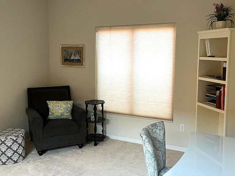 Office/den situated between living room and guest quarters.