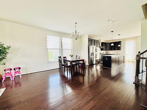Living room long shot with open kitchen and dining