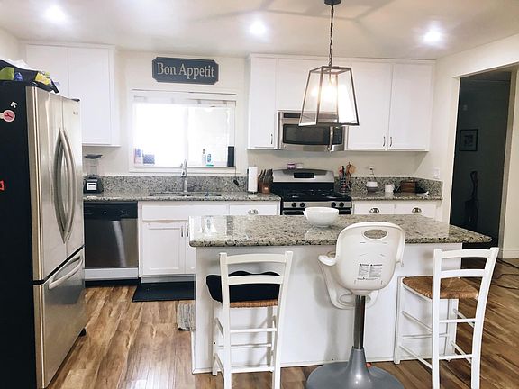 Recently updated kitchen with breakfast bar on the center is
