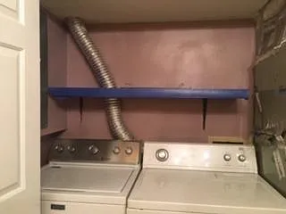 Washer/ dryer closet with storage shelf