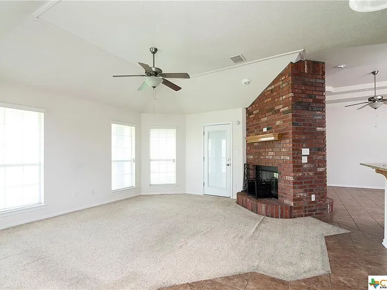 Family room leads to covered patio and back yard.