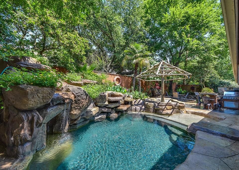 Welcome to this gorgeous back yard oasis ! Pool builders personal home.