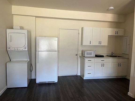 Partial Kitchen with Washer dryer and Refrigerator