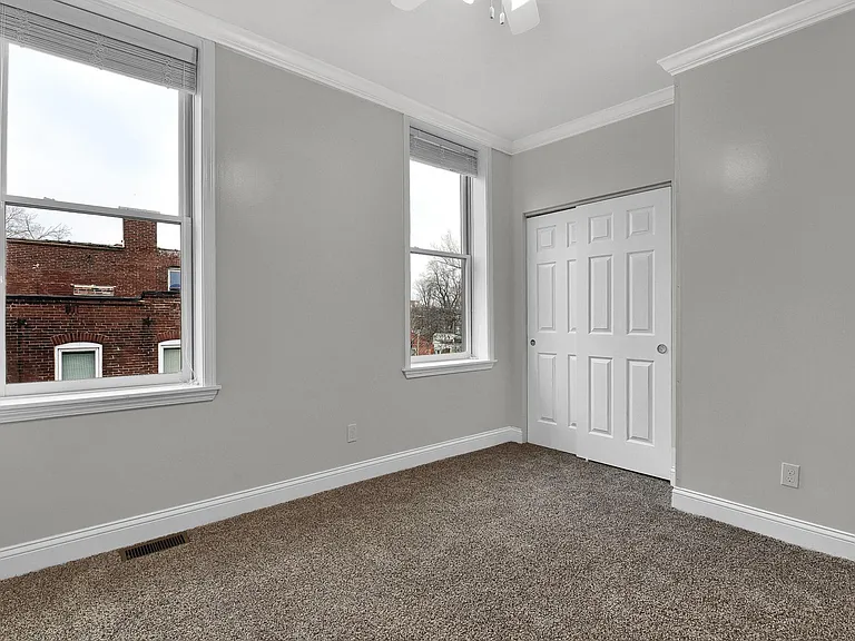 Bedroom 1 - level 2: 10' ceilings, large closet, ceiling fan, crown moulding