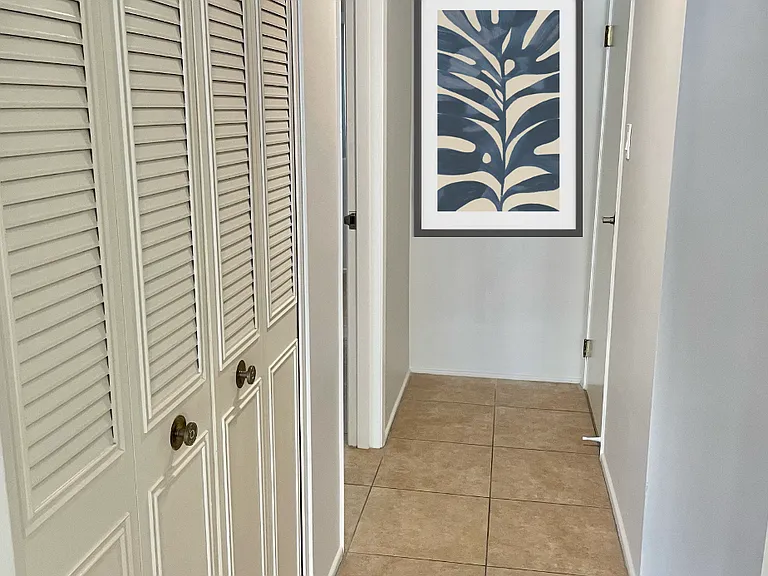 Hallway with storage closet