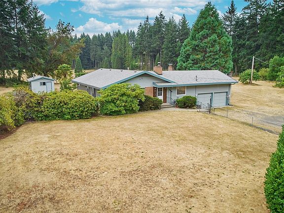 Gated front yard adds charm and provides a safe space for pets or children.>