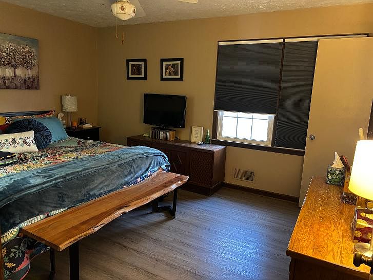 Picture shown with king size bed - the room could easily accommodate a variety of furniture layouts.