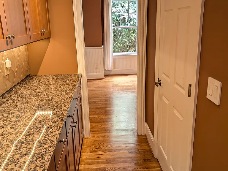 Butler's pantry off the kitchen and dining room provides ample cabinets AND a full pantry closet!