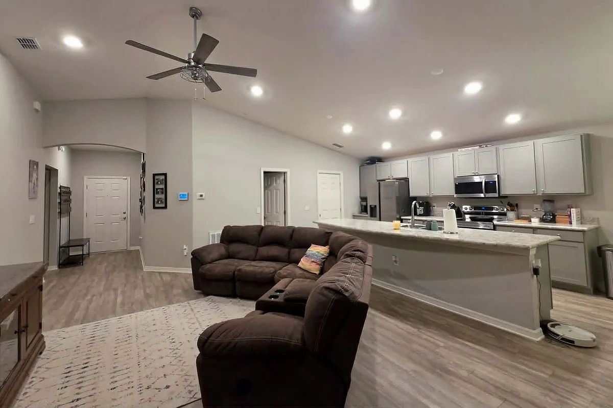 Spacious open-plan living room and kitchen with huge island. High ceilings make for plenty of room to relax and breath. - 965 Montgomery Ln