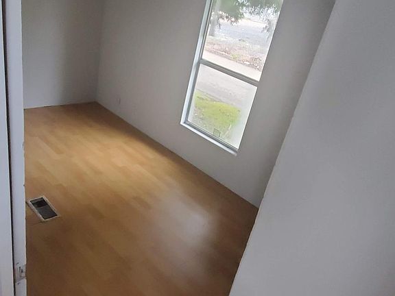 Unit A Smaller bedroom new laminate floors, newly painted
