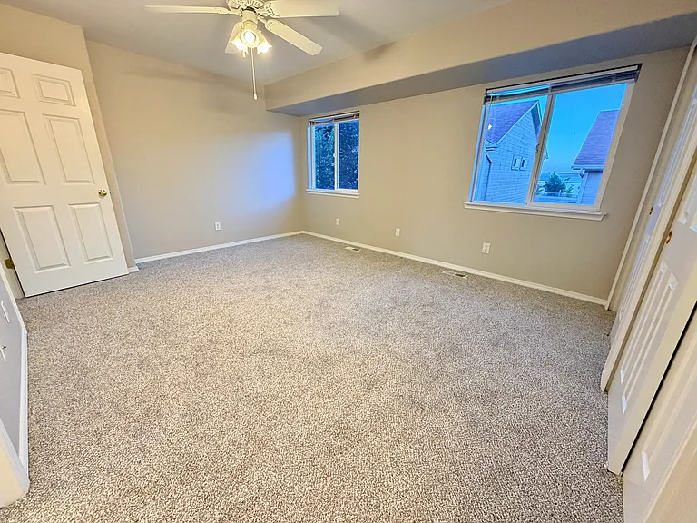Primary bedroom view from vanity shelf area leading in to jack and jill bathroom.