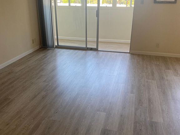 beautiful flooring with view of the City beyond