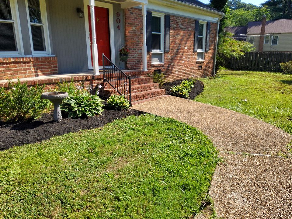 Walkway to your new home! Beautiful gardens frame house
