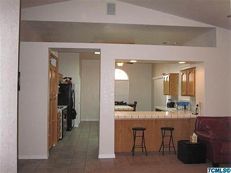 Nice open kitchen w/pantry, tile counters and floor
