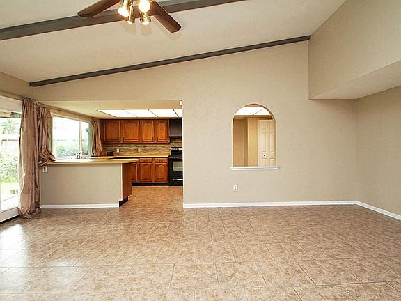 Family Room is open to the kitchen and has a pass through in the wall with room for seating at the c