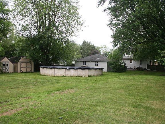 Above ground pool & 2 sheds