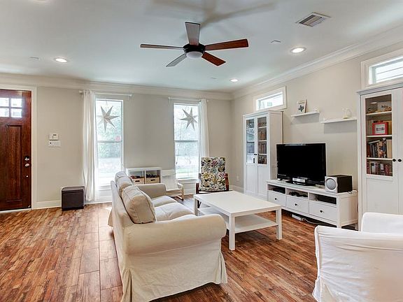 you enter into the open concept first floor Living Room, Kitchen, Dining Room