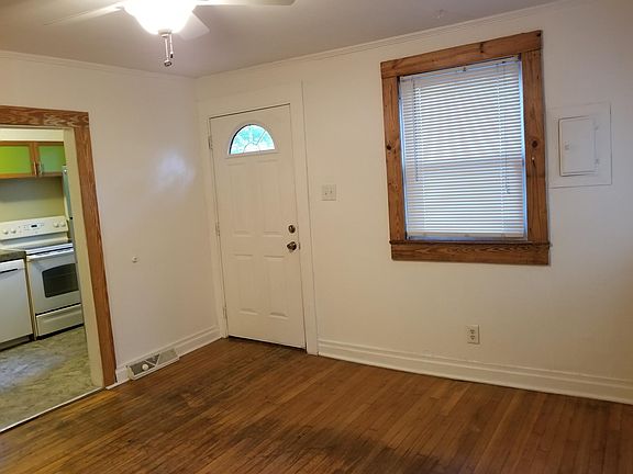 Livingroom - note floor is pitched slightly uphill (1") from right to left toward the kitchen wall. This is just 100 year old stone foundation movement - structurally sound.