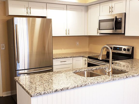 Eat-In Kitchen w/Granite Counters, White Cabinets & Stainless-Steel Appliances