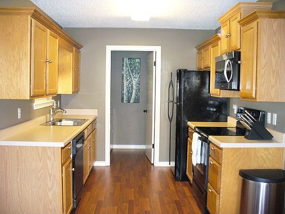 Appliances stay with home: fridge, range, dishwasher, and built-in microwave