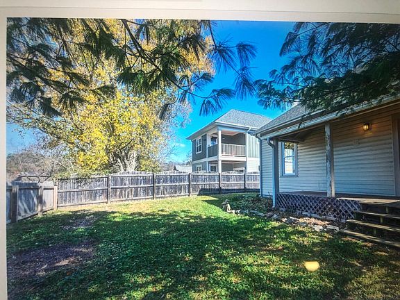 fenced in back yard with Rocking Chair Porch