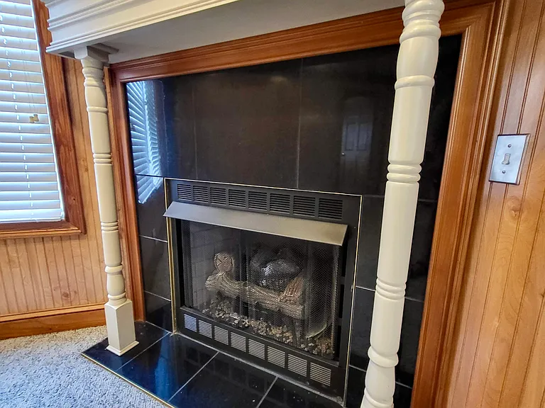gas log fireplace with custom mantle