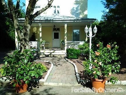 3 Story Victorian
						:
						front porch view with paver path/driveway