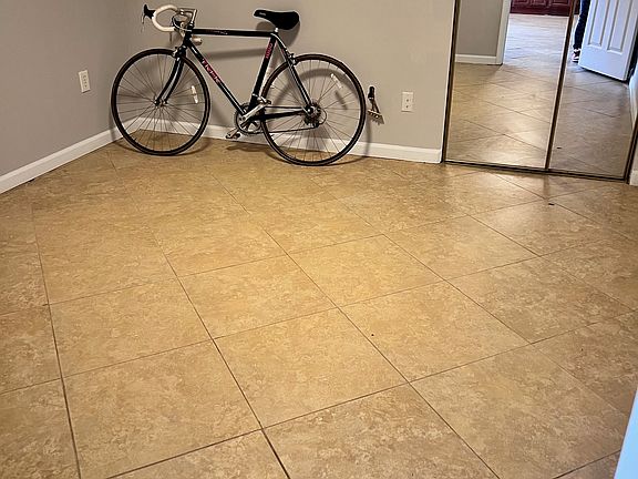 Primary bedroom, closet behind mirror doors.