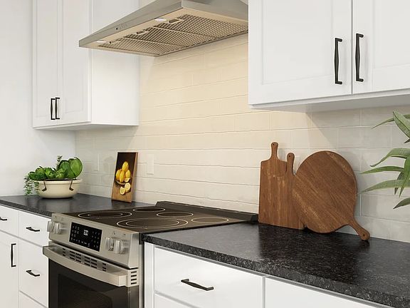 Kitchen with subway tile backsplash and stainless steel appliances