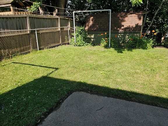 fenced in back yard and shed