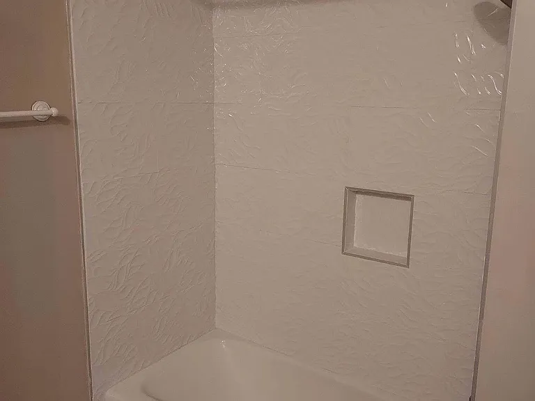New tile and faucets in hall bath (this photo shows old flooring)