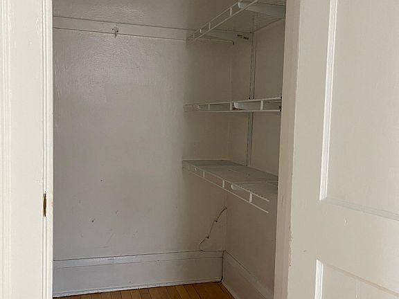 Walk-in closet with built in shelving