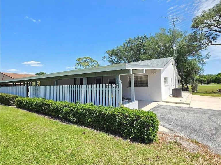 2702 Golf Hammock Dr — Photo 1