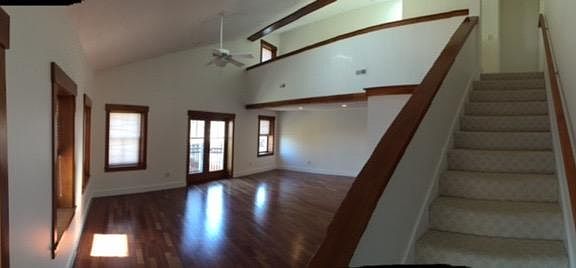 downstairs open concept living area. shown later in photo furnished.