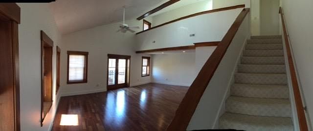 downstairs open concept living area. shown later in photo furnished.