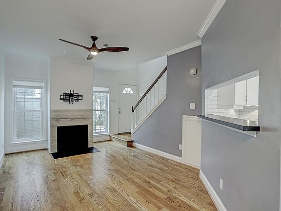 First floor living featuring a beautiful fireplace!