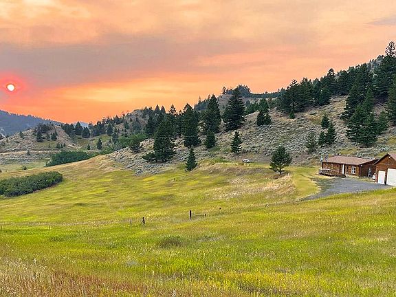 Spectacular Log Home on half section of land just 12 minutes from town!