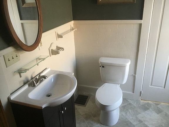 Full bath with tub shower.
