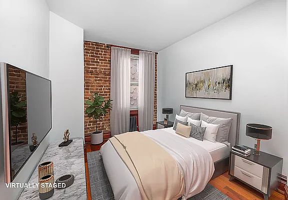 3rd image of 150 E 3rd St APT 4E