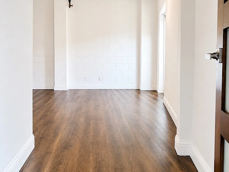 Alternate view of the bright and generously sized guest bedroom.