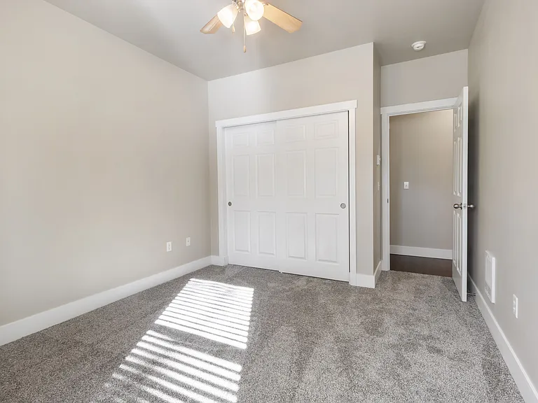 Bedroom 3 with large closet and ceiling fan