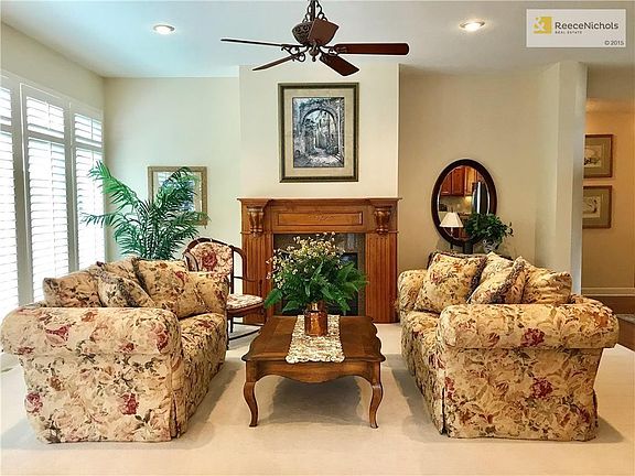 This great room is part of the open floor plan on the main level and offers a gas starter fireplace with Plantation shutters on the wall of windows to allow in natural light!
