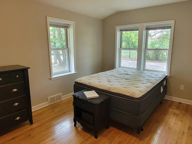 Master bedroom. looks out to your back yard and the neighborhood's little road -not often traveled by people who do not live in the neighborhood.