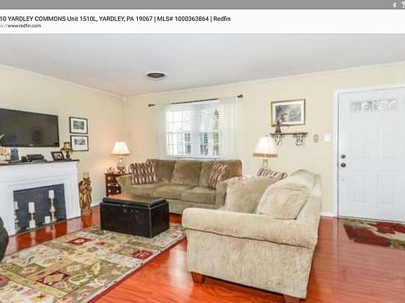 Spacious living room faces front lawn and woods Spacious living room with 2 closets