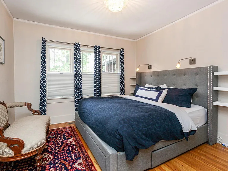 The primary bedroom with king bed, an oversized closet, under-bed storage, and black-out shades and curtains!