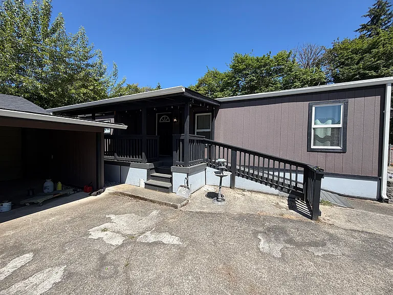 Entryway with covered front porch and ramp for easy access
