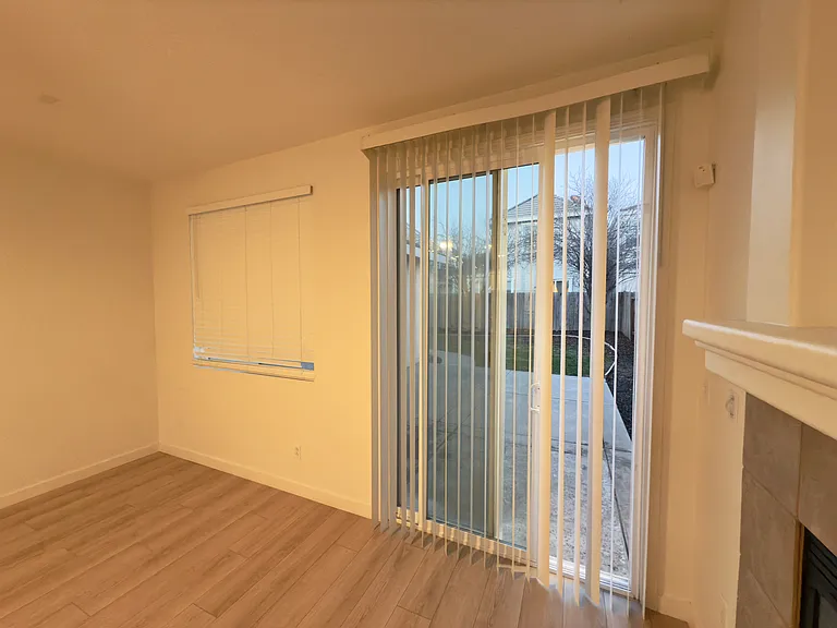 Living room with a convenient side door, offering easy access to the backyard and enhancing indoor-outdoor flow!