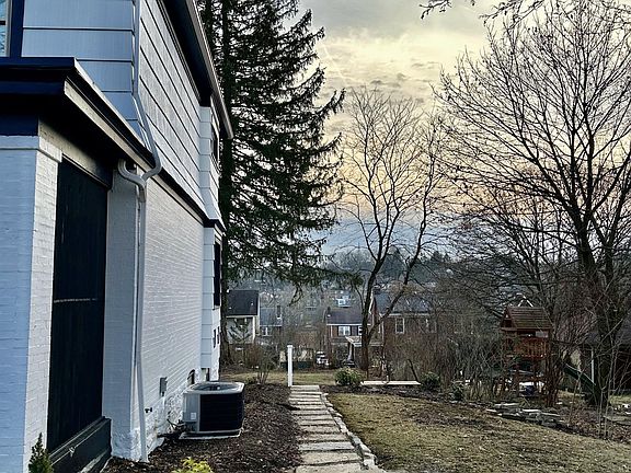 New Landscaping throughout the side yard leading to rear patio and yard!