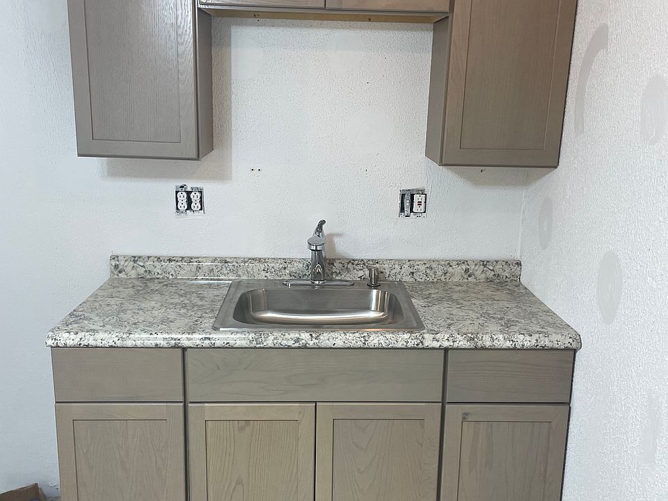 New Kitchen cabinets with pull out Moen faucet. 4 Outlets for all your kitchen appliance needs. Includes Microwave and bakers rack.
