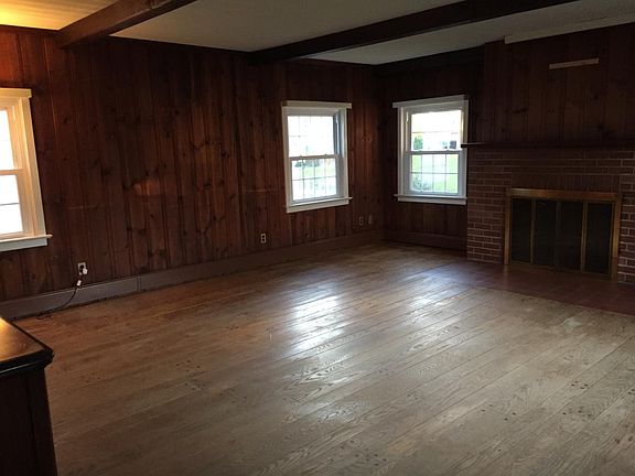 Beautiful hardwood floor and knotty pine paneling in LR/Study.